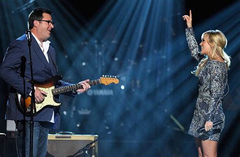 vince gill carrie underwood how great thou art How does the metaphor of How Great Thou Art apply to the artistic collaborations between Vince Gill and Carrie Underwood?